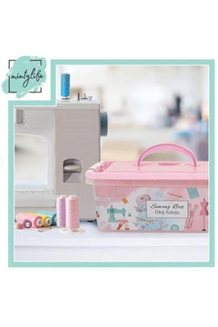 Pink plastic sewing box with removable dividers and carrying handle