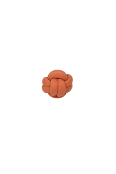 Decorative cinnamon-colored mini ball knot pillow
